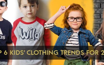 Quatre enfants en vêtements de marque tendances.